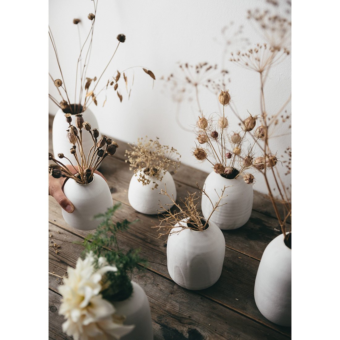 artificial flowers with small ceramic vase